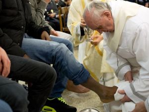 Pope Francis washes the feet of a prisoner at the Casal Del Marmo Youth Detention Centre during the mass of the Lord's Supper in Rome (Photo: L"osservatore Romano, Getty Images)