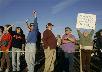 Death penalty supporters cheer outside the Florida State Prison moments after the execution of Danny Rolling in Starke, Fla., in this Oct. 25, 2006 file photo.